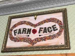 Love the art & the name! If you look close or zoom in, there’s a very cute, upside down, meditating frog 🐸 upside down at the top   at Farm to Face Cafe in Baltimore