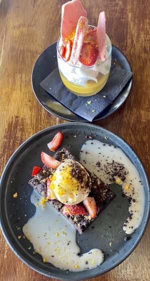 Amazing desserts! 
Top: Macadamia and maple purée with seasonal fruit and passionfruit puree
Bottom: Chewy walnut brownie with caramel sauce and passionfruit gel at You Came Again in West End