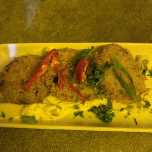 Fish cakes, crushed artichoke crumbed and fried on a bed of vegan tartare.   at You Came Again in West End