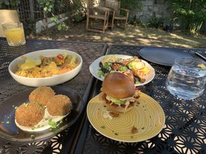 Dining in the back courtyard  at You Came Again in West End