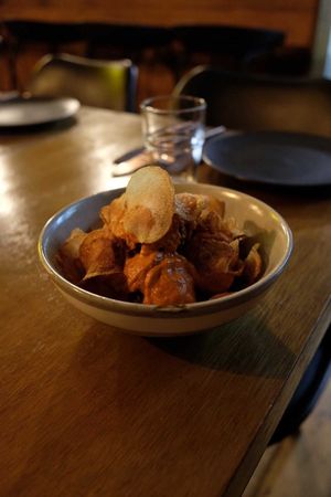 Meatballs with chips on top at You Came Again in West End