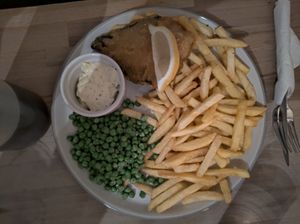Jackfish and chips with optional vinegar and tartare sauce at The Alleycat in Inverness