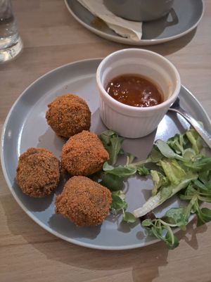 Haggis bon bons with sweet chilli sauce and side salad. at The Alleycat in Inverness