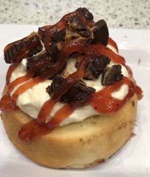 Peanut Butter Frosting with House-made Peanut Butter Cups & Strawberry Jam! at Cinnaholic in Corona