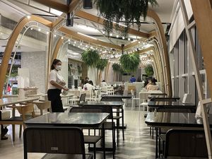 Food court seating. Some good views out of those windows.  at Talalaks Emporium Food Hall in Bangkok
