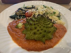 Romanesco Cauliflower with red pepper sauce and couscous 😋  at REfUSE Café in Chester-le-street