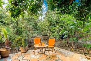 Terrace of Casa Mariposa inbetween Mangotrees, Papayas and Moringas at Finca Manantial de Luz in Almayate Alto