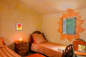 small appartment with 2 beds and separate kitchen and bathroom  at Finca Manantial de Luz in Almayate Alto