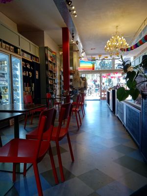 Inside Vegabond, with some of the indoor seating on the left and the deli counter on the right at Vegabond - West in Amsterdam