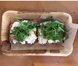 Spelt toast, almond brie, fig jam, rocket and walnuts at Vegabond - West in Amsterdam