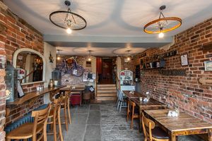 Our welcoming entrance with original cobbled floor at The Drop Off in Bury