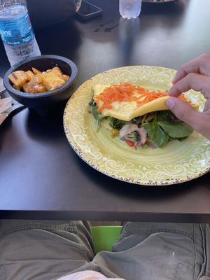 Vegetarian omelet with a side of sautéed potatoes    at Green Bites in Dorado