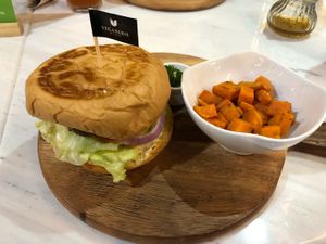 Vegan cheeseburger and sweet potatoes at Veganerie - Silom in Bangkok