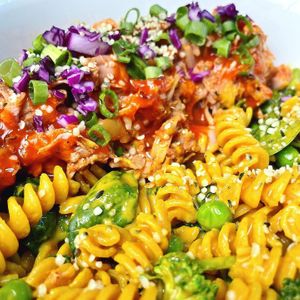 "The Buffalo Mac & Cheese" with Braised Jackfruit, drizzled buffalo sauce & house-made smoky cashew cheese sauce. #ProteinAndFiberPacked #GlutenFree #Vegan at Daily Fuel in Portland