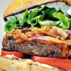 "The Dude" Burger. Toasted Ciabatta bun with soy-free lentil tempeh patty (25g of protein), caramelized onions, mild (house-made) horseradish ranch, & cashew cheese spread.  at Daily Fuel in Portland