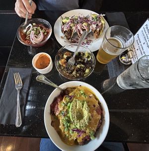 Potato bowl with chili, Brussel sprouts with aioli and BBQ jackfruit tacos  at Daily Fuel in Portland