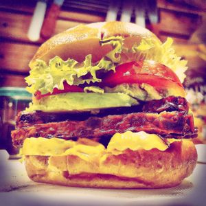 Soy free, maple tempeh burger with avocado on a pretzel bun.  at Daily Fuel in Portland