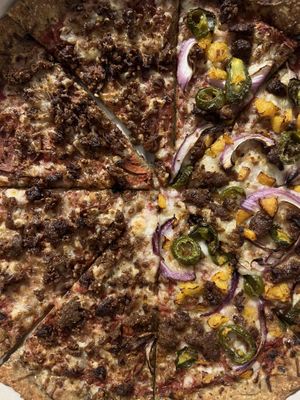 Half meat lovers & half peach pizza. Peach pizza was amazing  at Plant Based Pizzeria in Atlanta