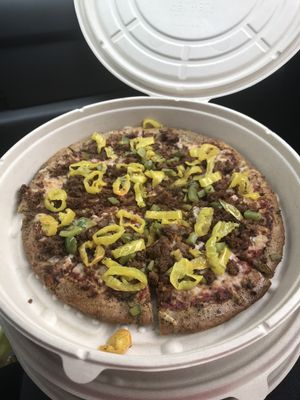 Meat lovers with green peppers and banana peppers  at Plant Based Pizzeria in Atlanta