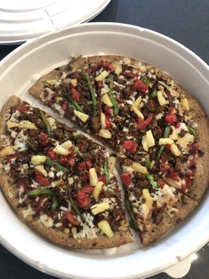Create your own pizza with bell peppers, pineapple and beyond meat sausage at Plant Based Pizzeria in Atlanta