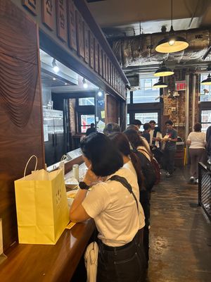 People eating at the counter   at mŏkbar in New York City