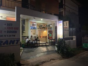 Pictures on the windows are displaying some fishfood but all what was inside looked and tasted vegan. at Dhana's Curry Pot in Mirissa