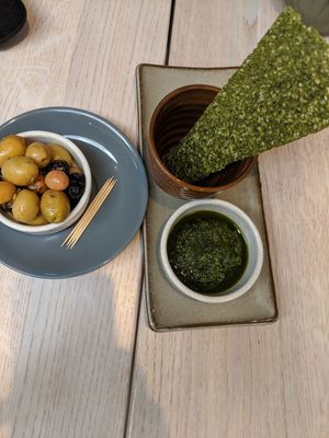 Starter, olives and dehydrated kale at Wild Food Cafe in North London