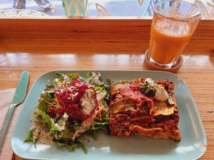 Lasagne, salad, carrot and ginger smoothie at Racines in Lausanne
