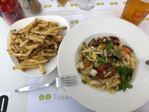 French fries (2.5€) and vegetarian pasta with no cheese on (8€). at Tuká Tulá in Sao Miguel