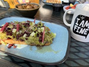 Vegan avocado toast, side of roasted potatoes. Drip coffee w/ oat milk. ✌🏻  at 4th Street Fillin Station in Cocoa Beach