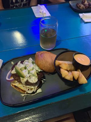 Impossible burger with a side of yuca fries and a vegan cream sauce  at 4th Street Fillin Station in Cocoa Beach