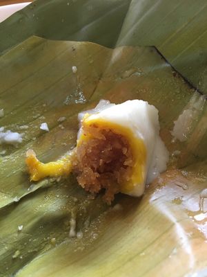 Khanom sod sai - shredded coconut filling inside steamed coconut cream at Jay That Phanom in Nakhon Phanom