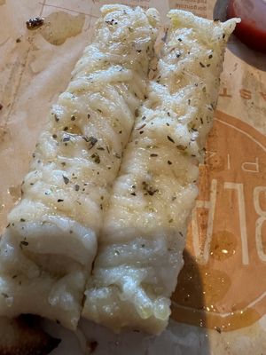 Vegan Cheesy Bread with dash of salt, and extra extra oregano, and olive oil drizzle at the end. There was a lot more to this but ate most of it already forgetting to take picture  at Blaze Pizza in Miami