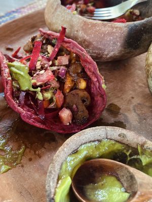Taco Rosa with some guac and salad shoveled on  at CocoFam in Puerto Escondido