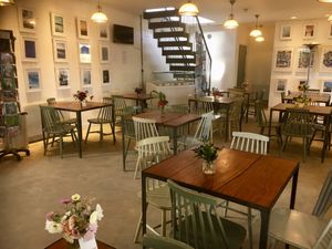 The interior of the Coal House Cafe showing the flowers from Woodberry Bloom on our tables. at The Coal House Cafe in North London
