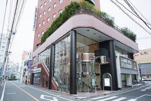 What the entrance looks like from across the street. at Emblem Cafe & Bar in Tokyo