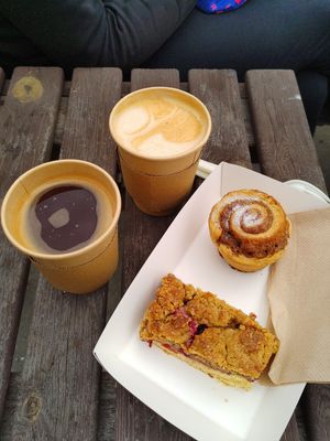 Coffee, Oat Caramel Latte, cinnamon bun and rasberry+nectarine crumble slice at Olive & Co.  in Liskeard
