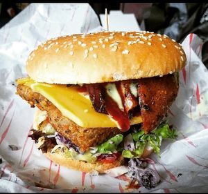 Seitan Chiken Burger With Cheese and Seitan Bacon,  Garlic Ranch Mayo, BBQ sauce at Vegan House in Bangor