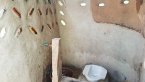 The toilet! With recycled stain glass windows/recycled bottles at Thai Zen Farm in Pai