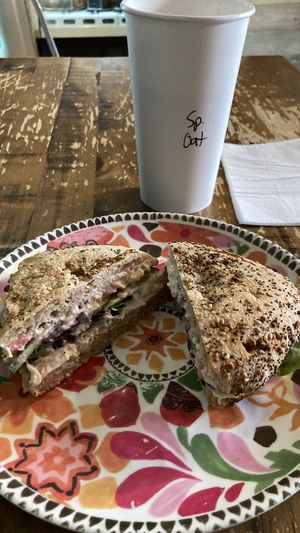 Everything Philly muffin with hummus and spiced coffee with oat milk 😋  at Knockbox Cafe in Philadelphia