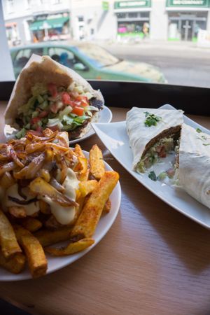 Vöner in wrap, Vöner in bread and special fries with cheesy sauce and caramelized onions at Vöner der Vegetarische Döner in Berlin