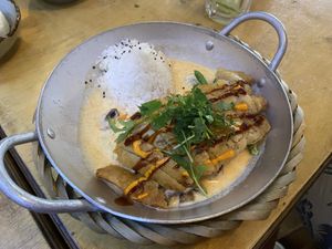 Mango coconut curry with fried chicken: very good, but not spicy (as a real curry should be) at Sunshine Vegan Restaurant in Berlin