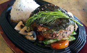 Fish imitation with Lolot leaf, dill, tomatoes and zucchini on rice at Sunshine Vegan Restaurant in Berlin