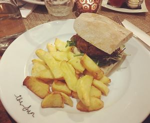 Artichoke and nuts burger with hand-cut fries at The Sun in Carshalton