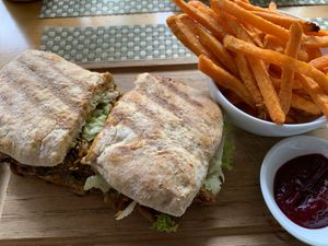 “Pulled pork” sandwich made with mushrooms. Served with sweet potato fries and beet ketchup   at Lavka in Guatemala City