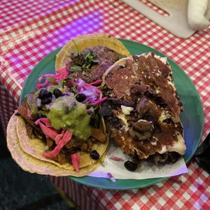 Couple tacos and a volcane loaded with vegan cheese  at Gracias Madre in Mexico City