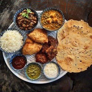 Indian platter: vegan samosas, pakoras, curries & dips at Drift Bar in Santa Teresa