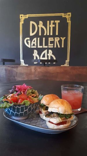 Sliders with French brie, tomato, arugula, oven roasted leeks and walnuts. Served with organic side salad  at Drift Bar in Santa Teresa