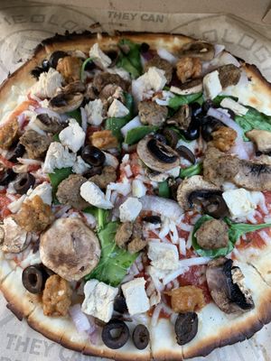 Vegan cauliflower crust with red sauce vegan cheese vegan meat and lots of veggies:)  at Pieology in Kailua