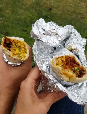 Breakfast burrito with roasted veggie and El Beso at Hoja in Denver